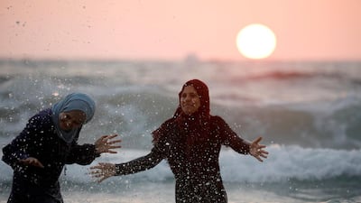 Women enjoy themselves along the shore of the Mediterranean Sea during Eid al-Fitr at a beach in Tel Aviv, Israel. Reuters