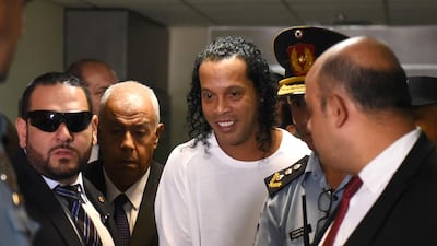 Former Brazil forward Ronaldinho arrives at Asuncion's Justice Palace to testify about his irregular entry to the country, in Asuncion, on March 6, 2020. AFP