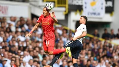 Liverpool’s Roberto Firmino in action with Tottenham’s Kyle Walker. Dylan Martinez / Reuters