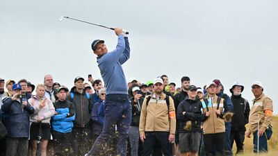 England's Justin Rose watches his approach shot from the rough on the 15th hole. AFP