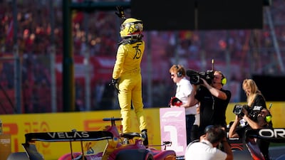 Ferrari's Charles Leclerc celebrates after claiming pole. PA