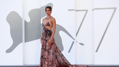 Model Taylor Hill, in Etro, walks the red carpet ahead of the Opening Ceremony during the 77th Venice Film Festival on September 2, 2020 in Venice, Italy. EPA