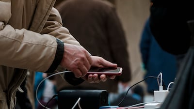 Charging stations have become ubiquitous in public spaces, including malls, hotels, restaurants and parks. AFP