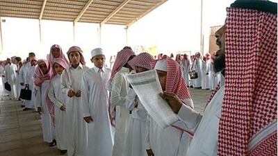 A teacher takes attendance at a school in Riyadh. Some land designated for schools in Riyadh has been illegally transferred to other owners, a local professor says.