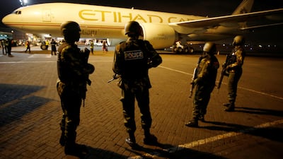 Police officers guard a plane transferring a shipment of presidential election ballots ahead of Kenya's August 8 election at the Jomo Kenyatta international airport in Nairobi on July 31, 2017. Reuters / Baz Ratner