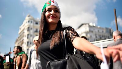 Algerian students raise banners and placards as they take part in a demonstraion in the capital Algiers. AFP