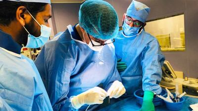 Surgeons at NMC Royal Hospital, Abu Dhabi, perform balloon dilation of a young boy's pulmonary valve. Photo: NMC