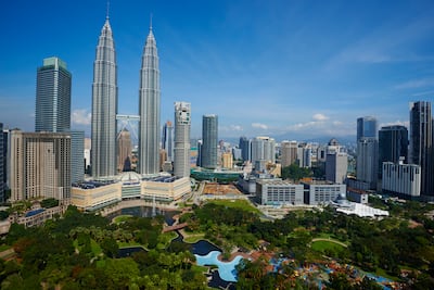 Kuala Lumpur is a mix of modern skyscrapers, traditional markets and green spaces. Photo: Bruno Morandi / Corbis