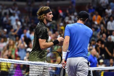 Stefanos Tsitsipas and Andy Murray greet each other at the net after their US Open first round match. AFP