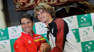 Rafael Nadal, left, and Alexander Zverev shake hands ahead of the Davis Cup tie between Spain and Germany. Manuel Bruque / EPA