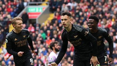 Arsenal's Gabriel Martinelli celebrates scoring their first goal with Martin Odegaard and Bukayo Saka. Reuters