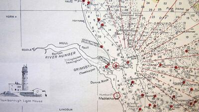 A sea chart showing coastal waters are seen on the walls of the Jubilee Fishing Company in Grimsby. Phil Noble / Reuters