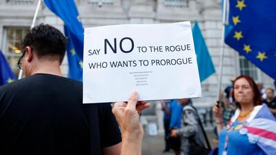Anti-Brexit demonstrators protest outside the Cabinet Office in central London on Thursday amid opposition to prime minister Boris Johnson's move to suspend parliament. Alastair Grant / AP