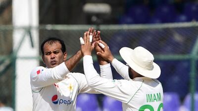 Pakistan's Nauman Ali, left, celebrates after the dismissal of Cameron Green. AFP
