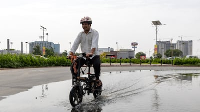 Large puddles form in Dubai Sports City after heavy rain. Chris Whiteoak / The National