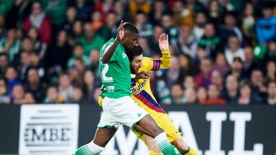Lionel Messi fights for the ball with Emerson Royal of Real Betis. Getty Images