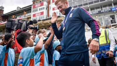 Johnny Bairstow high fives school children during the England ICC World Cup Victory Celebration at The Kia Oval in London, England. Getty Images