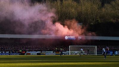 Crystal Palace fans let off a smoke bomb during the FA Cup third round match against Dover Athletic in Dover on Sunday. Michael Regan / Getty Images
