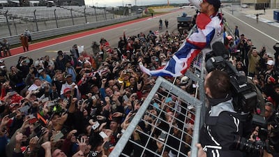 Mercedes’ Lewis Hamilton waves to fans after his win at the United States Grand Prix on Sunday to become F1 world champion for a second successive year. Mark Ralston / AFP