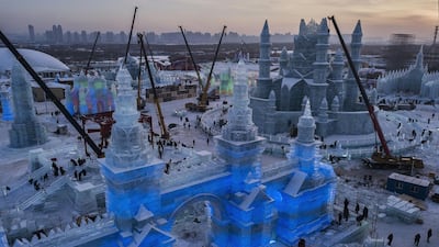 Chinese labourers work to finish large ice sculptures in preparation for the Harbin Ice and Snow Festival in Harbin, China. Getty Images