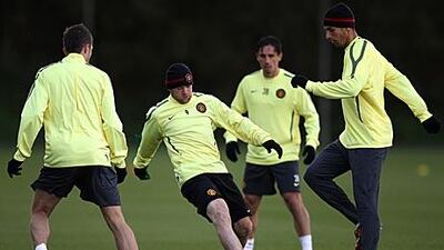 Wayne Rooney, centre, trained with Manchester United on Tuesday before picking up a knock.