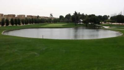 The fifth hole of the Majlis course at the Emirates Golf Club forces you to check your shot due to the large pond next to the green.