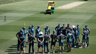 Australia caoch Justin Langer speaks to his players at the Gabba. Getty