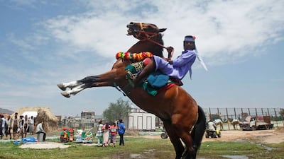 A Bedouin man rides a horse during the Sanaa Summer Festival in Sanaa. Khaled Abdullah / Reuters