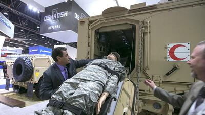 Oshkosh staff demonstrate the usage of an M-ATV ambulance variant at Idex 2015. Silvia Razgova / The National