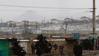 Afghan security officials stand guard outside the Marshal Faheem Military academy, after an attack in Kabul, Afghanistan. Jawad Jalali / EPA