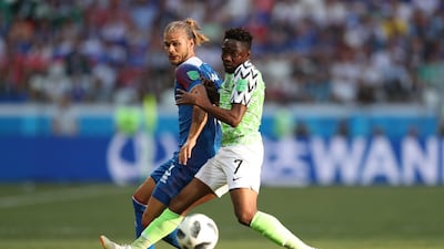 Iceland's Rurik Gislason challenges Nigeria's Ahmed Musa for the ball. Catherine Ivill / Getty Images