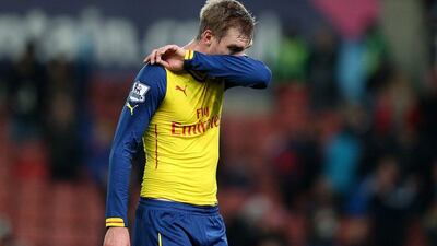 Per Mertesacker of Arsenal reacts at the end of his side's 3-2 loss to Stoke City on Saturday. Clive Mason / Getty Images