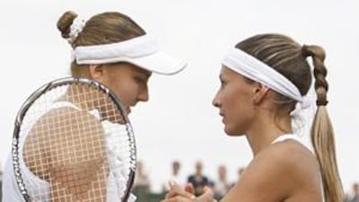 Gisela Dulko congratulates Nadia Petrova after her victory.