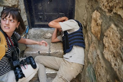 The National photographer Charlie Faulkner with Palestinian journalist Saif Al Qawasmi after he was attacked by young Israelis during the Flag Day march through Jerusalem on June 5. Photo: Maya Levin / X