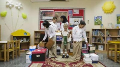 Al Shohub school pupils with donations. From left, Sana Kamall, Jana Van Zyl, Sanaa Sheikh, Joseph Moore and Salama al Suweidi.