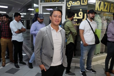 Former call-centre operator Sunnie Banquite with other applicants for the RTA jobs, at the Privilege Labour Recruitment Office in Dubai. Pawan Singh / The National