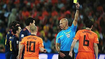 Eye of the storm: Howard Webb produced 13 yellow cards and one red card during the World Cup final.