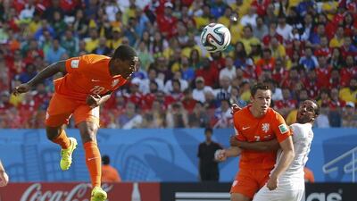 Leroy Fer heads in Netherlands' first goal in a 2-0 win over Chile on Monday at the 2014 World Cup in Brazil. Maxim Shemetov / Reuters / June 23, 2014