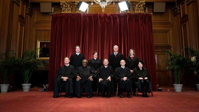 Seated from left: Associate Justice Samuel Alito, Associate Justice Clarence Thomas, Chief Justice John Roberts, Associate Justice Stephen Breyer and Associate Justice Sonia Sotomayor, standing from left: Associate Justice Brett Kavanaugh, Associate Justice Elena Kagan, Associate Justice Neil Gorsuch and Associate Justice Amy Coney Barrett pose during a group photo of the Justices at the Supreme Court in Washington, DC. AFP