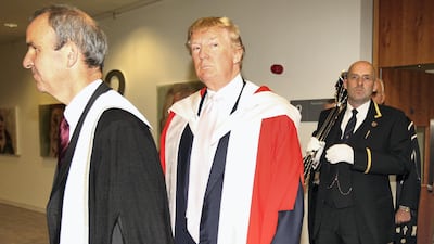 Donald Trump stands in his ceremonial robes before receiving his honourary award of Doctor of Business Administration from Robert Gordon University in Aberdeen, Scotland, in 2010. Getty Images