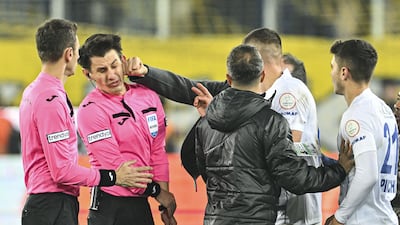 Referee Halil Umut Meler is punched by Ankaragucu president Faruk Koca after the Super Lig match against Rizespor at the Eryaman Stadium on December 11 2023