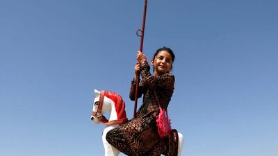 An Afghan girl rides on swings during the first day of the Muslim holiday Eid Al Adha in Kabul, Afghanistan. Mohammad Ismail / Reuters