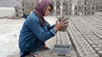 Sitara Wafadar, 18, who dresses as a male in order to support her family, working at a brick factory in Sultanpur village in Surkh Rod district, in Afghanistan's eastern Nangarhar province. Noorullah SHIRZADA / AFP