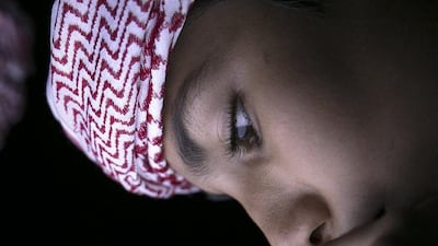 ABU DHABI, UNITED ARAB EMIRATES, Nov. 14, 2013: Brothers (R) Khaled, 13, and (L) Mohammed, 11, al Hadrami, play with bubbles building a consistent mass, as they and they family join other people in playing and exploring science through various activities prepared for them at the Science Festival on Thursday, Nov. 14, 2013, at the Corniche in Abu Dhabi. (Silvia Razgova / The National)Section: NationalPublication: Nov. 15, 2013Reporter: