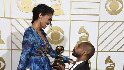 Kirk Franklin, right, winner of the award for best gospel performance/song for Wanna Be Happy?, and Tammy Collins pose in the press room at the 58th annual Grammy Awards at the Staples Center. Chris Pizzello / Invision / AP