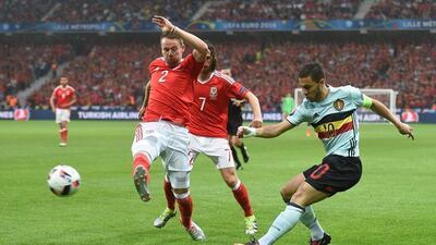 Wales defender Chris Gunter and Belgium forward Eden Hazard vie for the ball. Paul Ellis / AFP