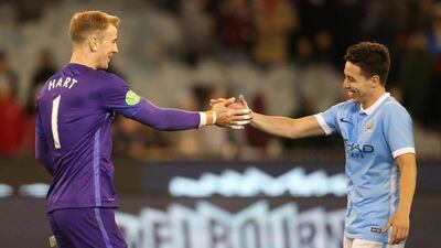 Joe Hart and Samir Nasri of Manchester City celebrate victory over AS Roma in the International Champions Cup pre-season tournament in Australia on Tuesday. Jason O'Brien / Action Images / Reuters