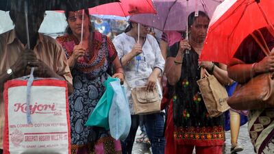 Shoppers holding non-plastic carry at a market in Mumbai, after India's western state of Maharashtra enforced its state-wide ban on a wide range of single-use plastic items. Rajanish Kakade / AP