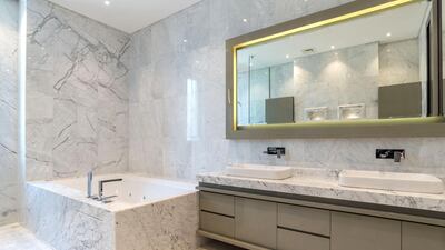 There's no shortage of space for those who spend plenty of time in the bathroom. Courtesy LuxuryProperty.com