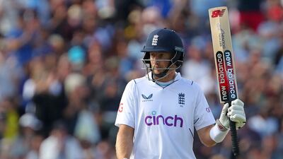 England's Joe Root celebrates his half century. AFP